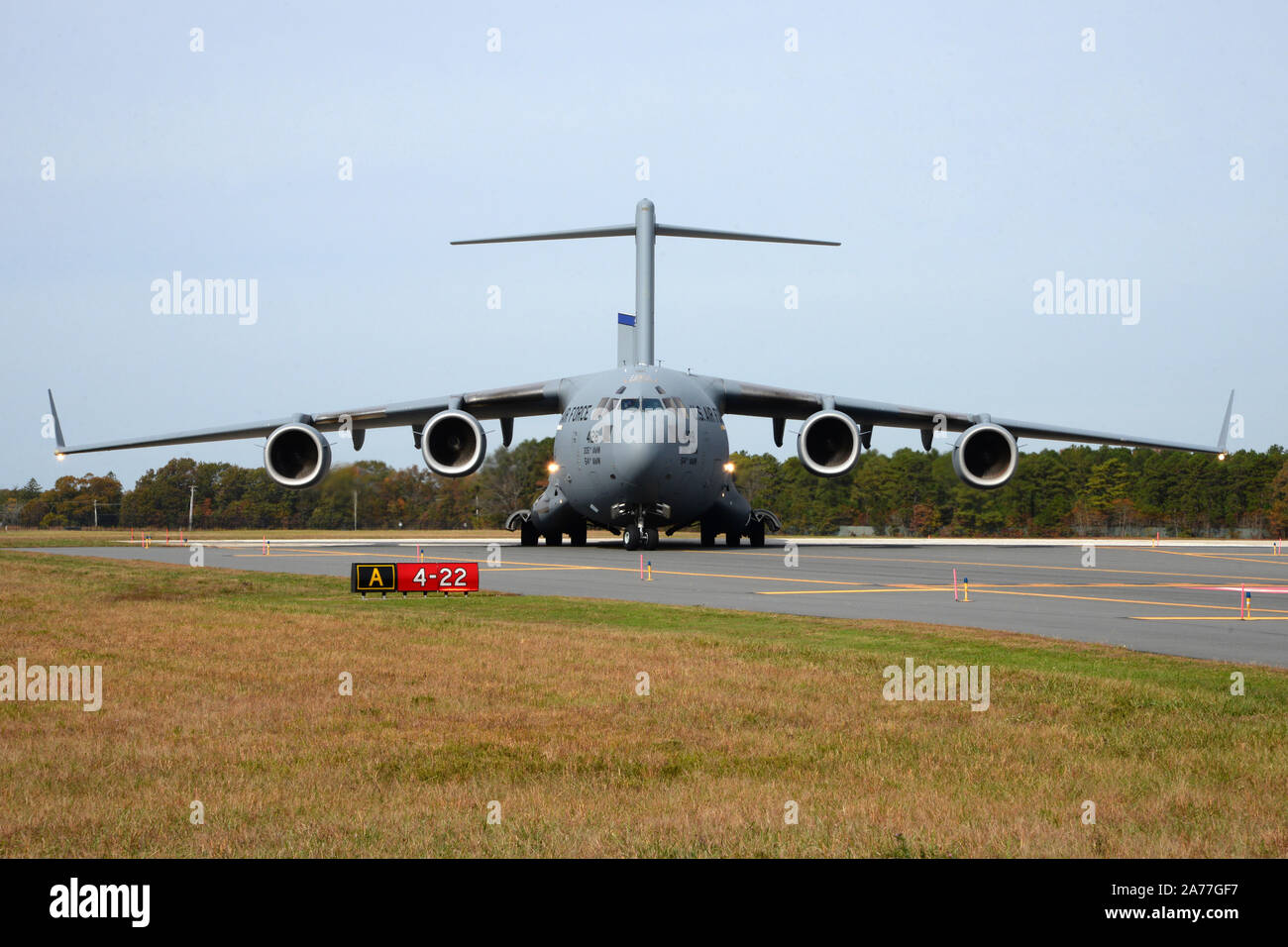 U.S. Air Force C-17 Globemaster III, from the 6th Airlift Squadron out of Joint Base McGuire-Dix-Lakehurst, exits the taxiway onto the Atlantic City Air National Guard Base, New Jersey, during a training exercise October 25, 2019. Exercise Operation Jersey Shield is designed to evaluate and ensure mission readiness of the 177th Fighter Wing in support of worldwide deployment. (U.S. Air National Guard photo by Senior Master Sgt. Andrew J. Moseley) Stock Photo