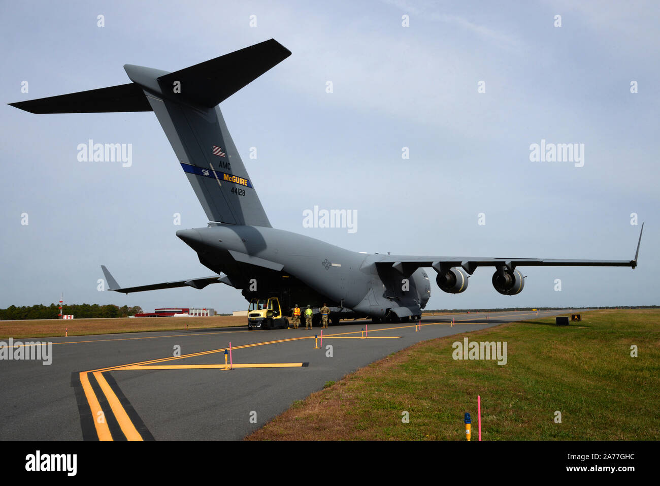 U.S. Air Force C-17 Globemaster III, from the 6th Airlift Squadron out of Joint Base McGuire-Dix-Lakehurst, opens its cargo door after landing at the Atlantic City Air National Guard Base, New Jersey, during a training exercise October 25, 2019. Exercise Operation Jersey Shield is designed to evaluate and ensure mission readiness of the 177th Fighter Wing in support of worldwide deployment. (U.S. Air National Guard photo by Senior Master Sgt. Andrew J. Moseley) Stock Photo