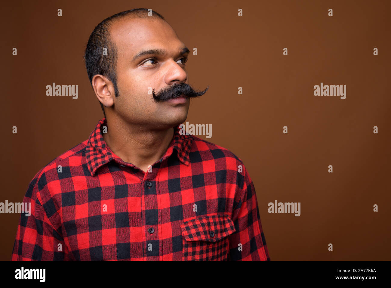 Face of Indian hipster man with mustache Stock Photo