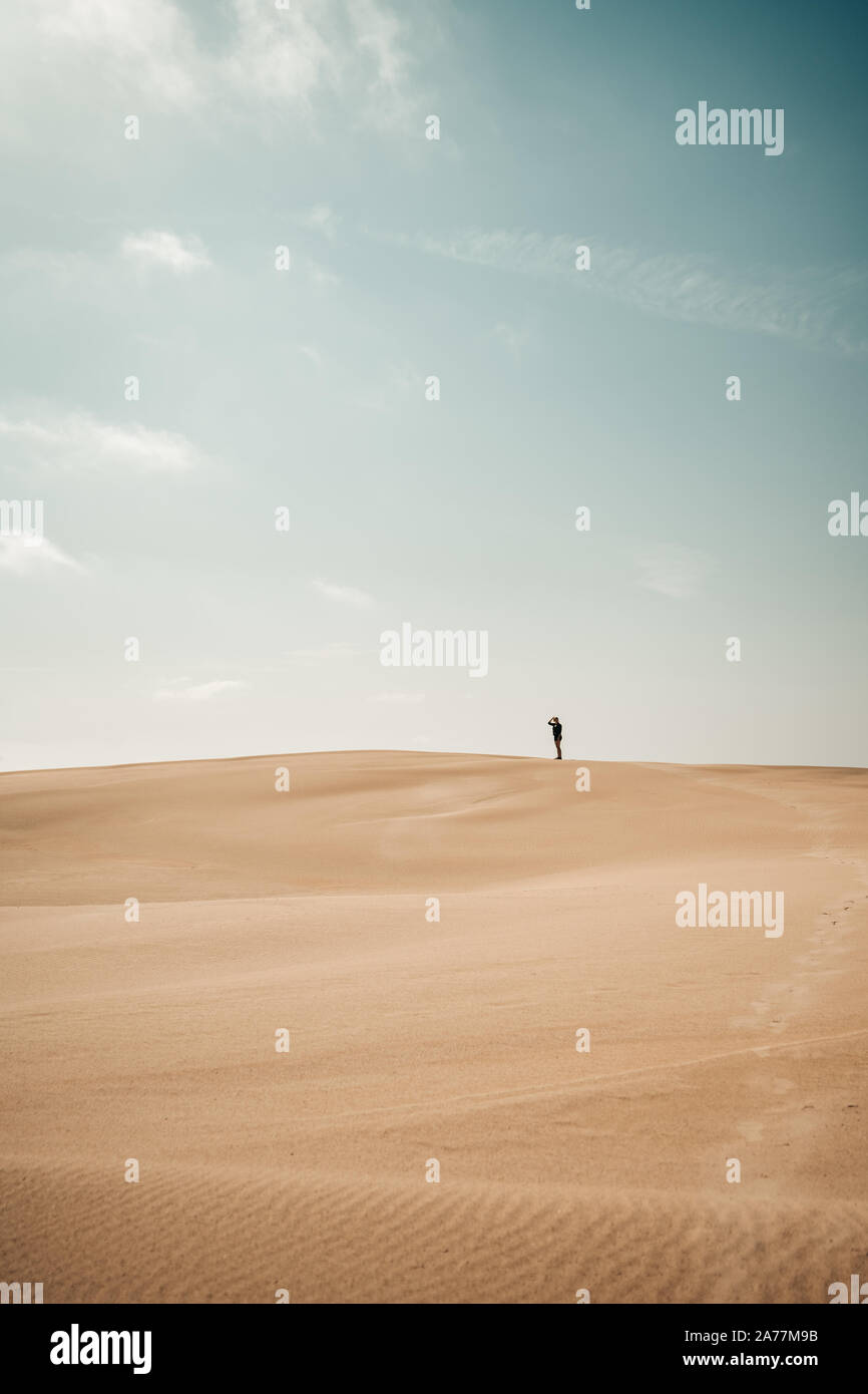 Person walks around on a Sand Dune Stock Photo