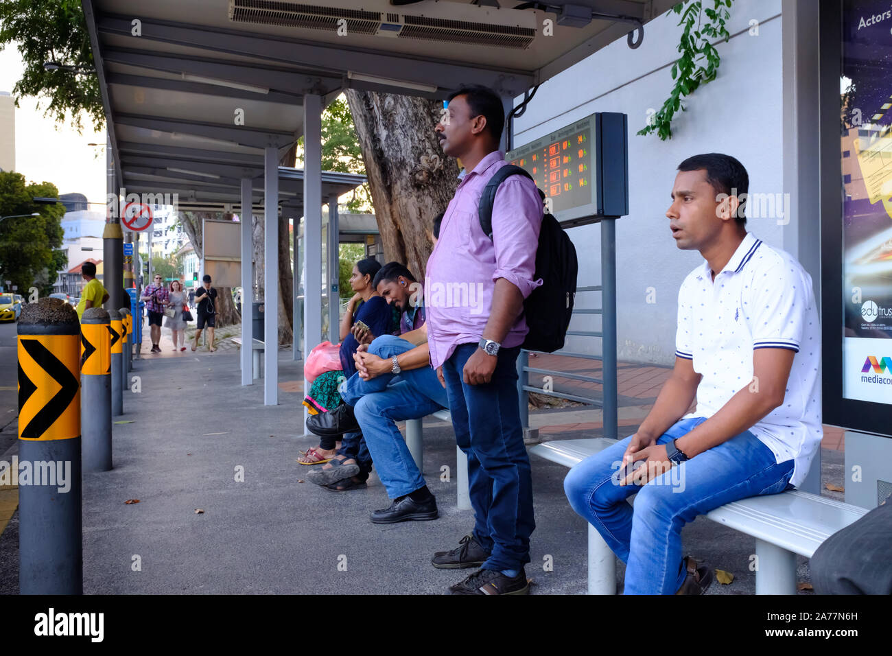 Singapore-17 MAR 2018: Indians waiting for the bus in bus stop Stock Photo
