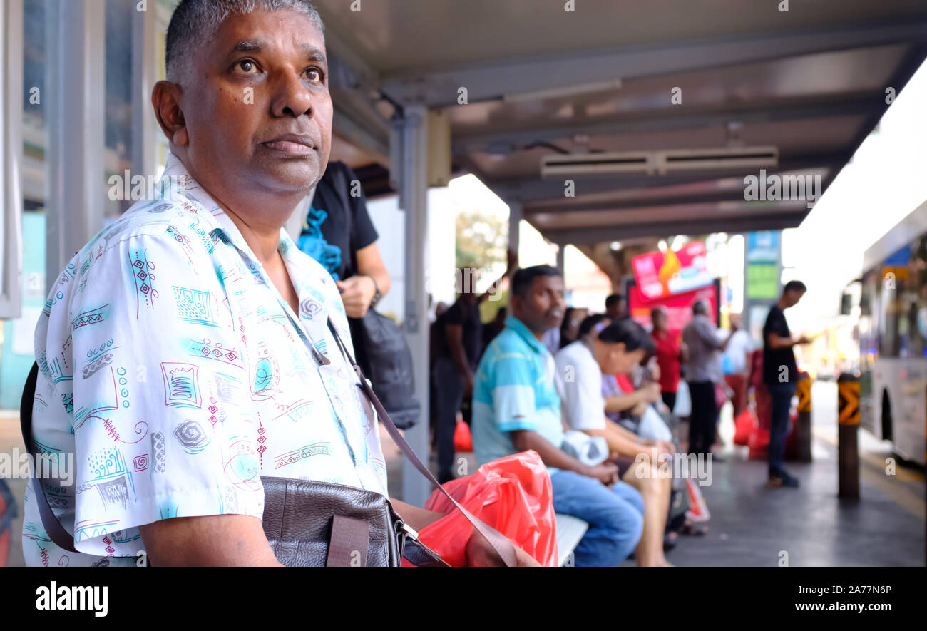 Singapore-17 MAR 2018: Indians waiting for the bus in bus stop Stock Photo