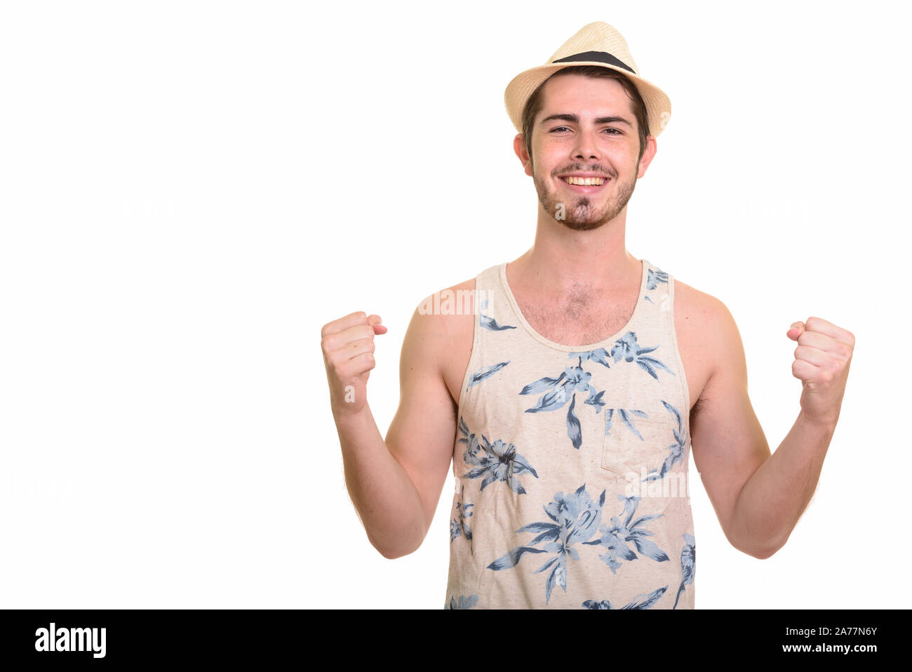Happy young handsome bearded tourist man ready for vacation Stock Photo