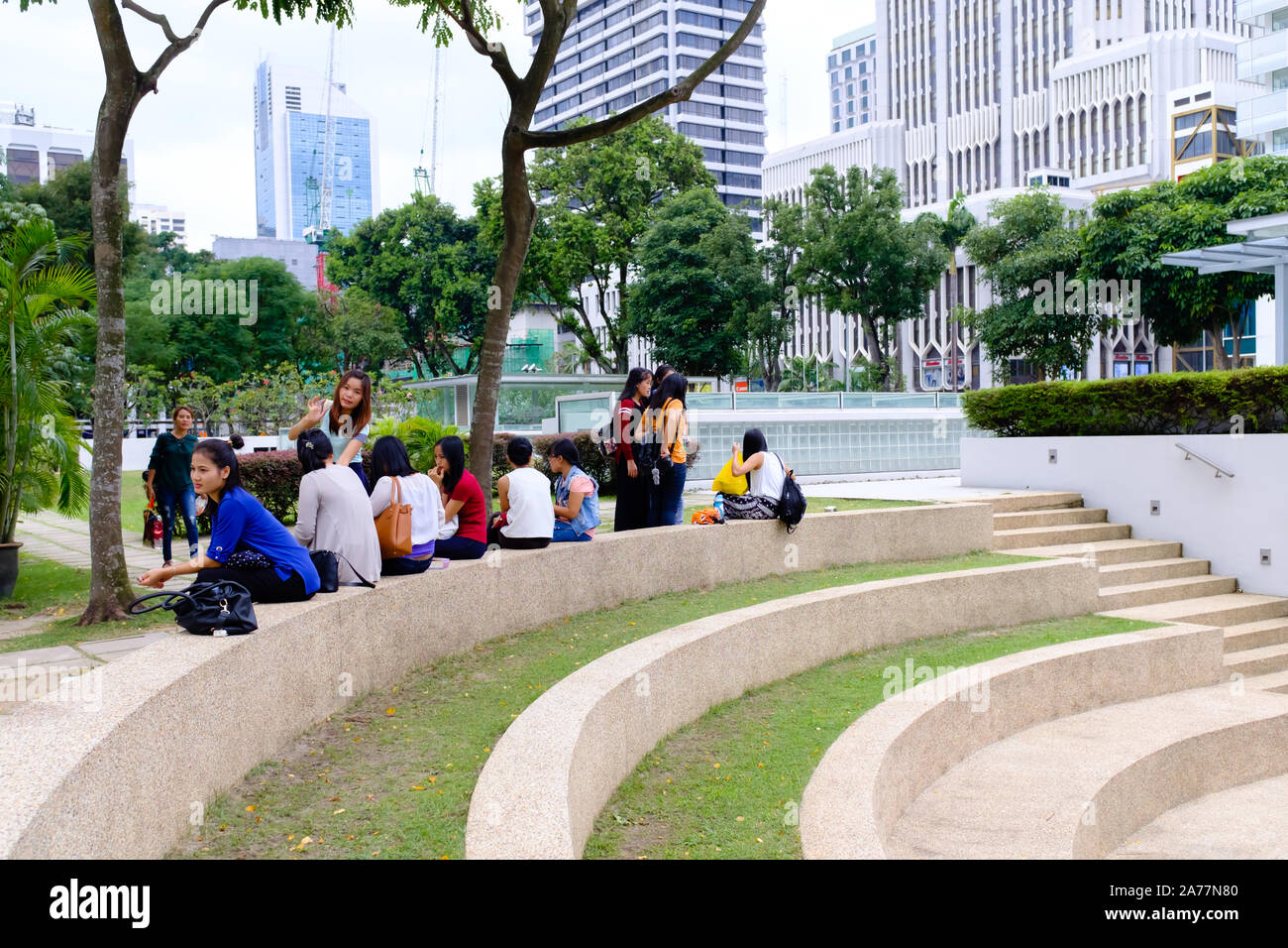 Singapore-18 MAR 2018: Singapore maids get together in public park on Sunday , enjoy holiday Stock Photo