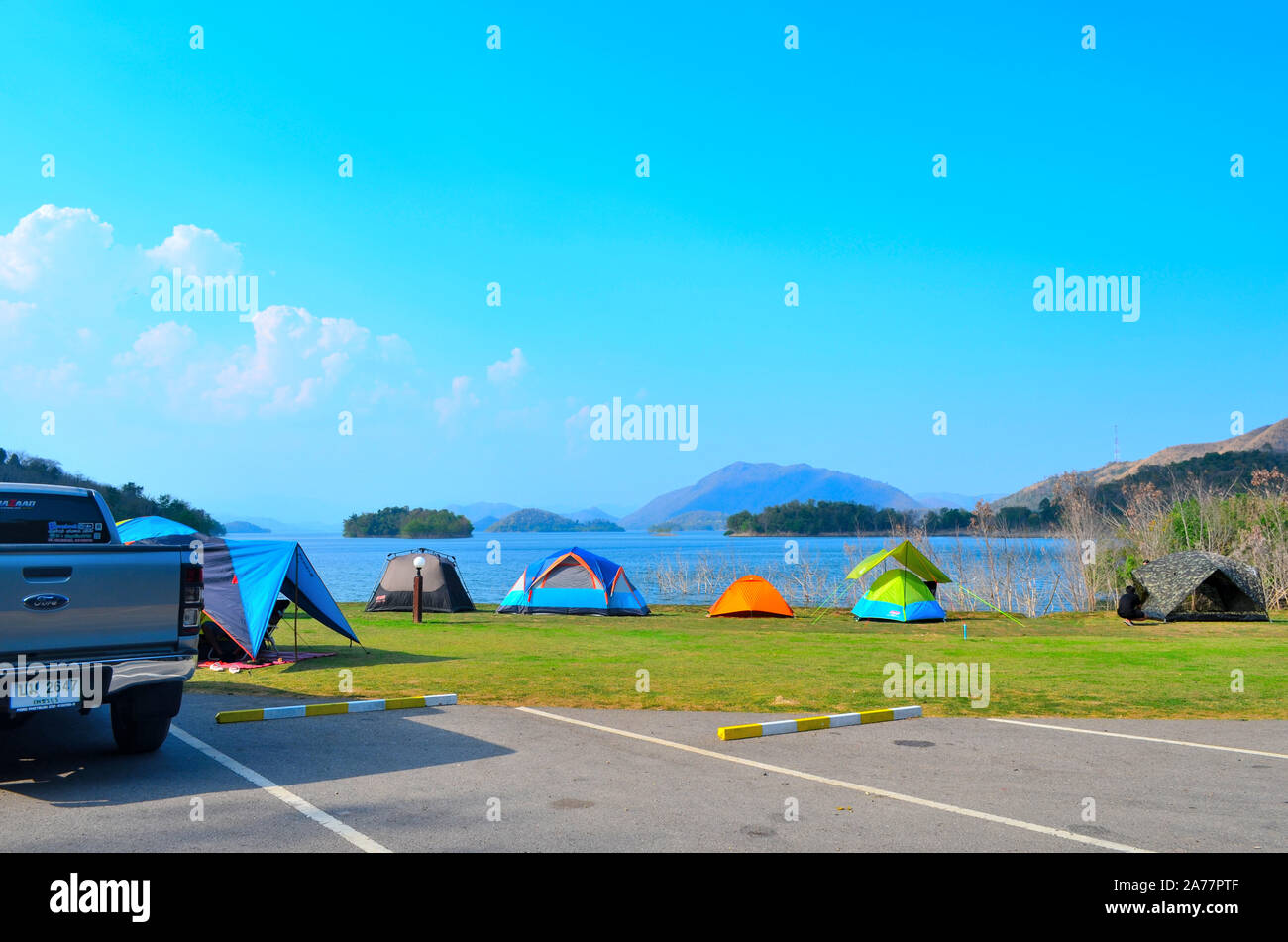 Tents that people have set up for a weekend away at Kaeng Krachan Dam in Petchaburi Thailand Stock Photo