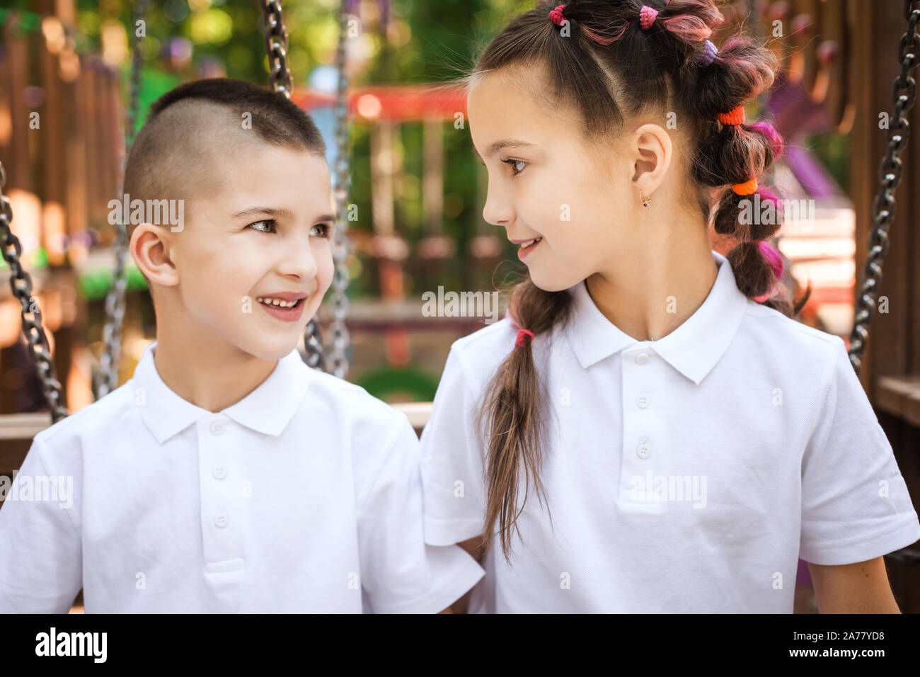 boy and girl looking at each other Stock Photo - Alamy