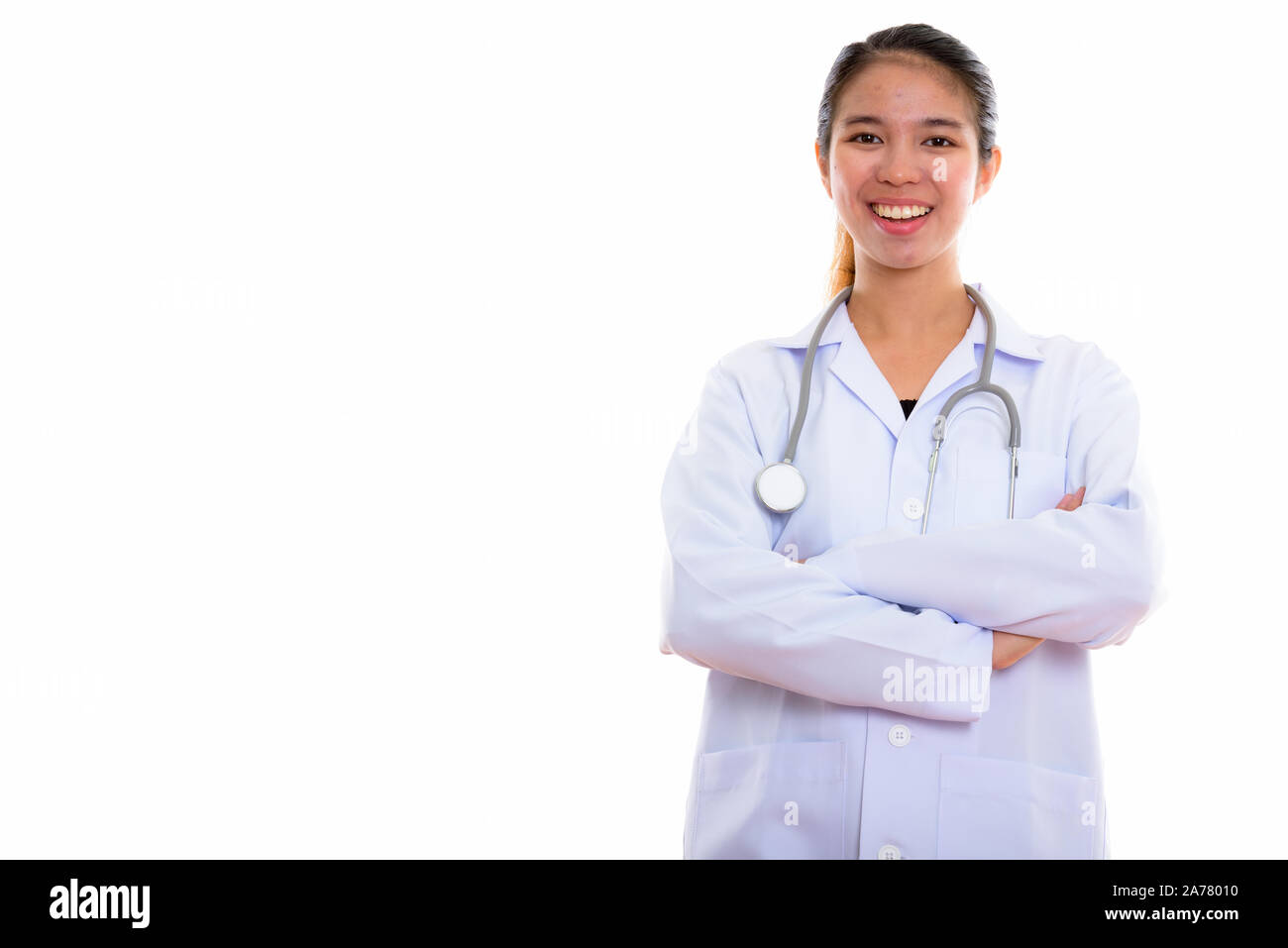 Portrait of young Asian woman doctor against white background Stock ...