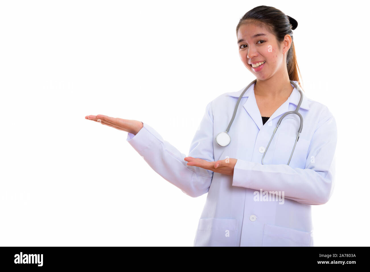 Portrait of young Asian woman doctor against white background Stock ...