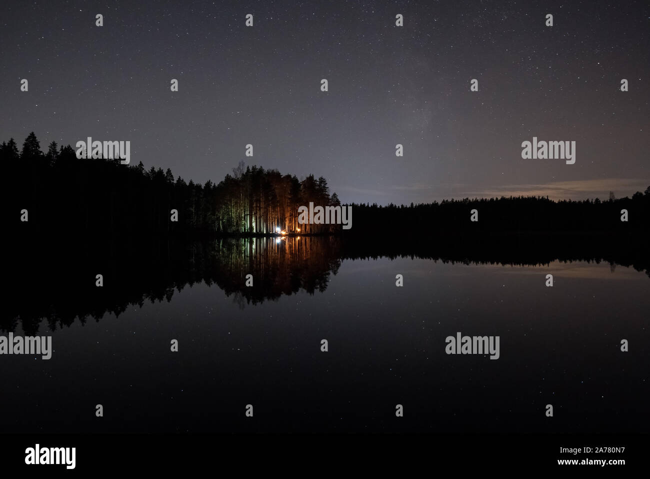 Campfires and Milky Way seen in Nuuksio National Park, Vihti, Finland Stock Photo