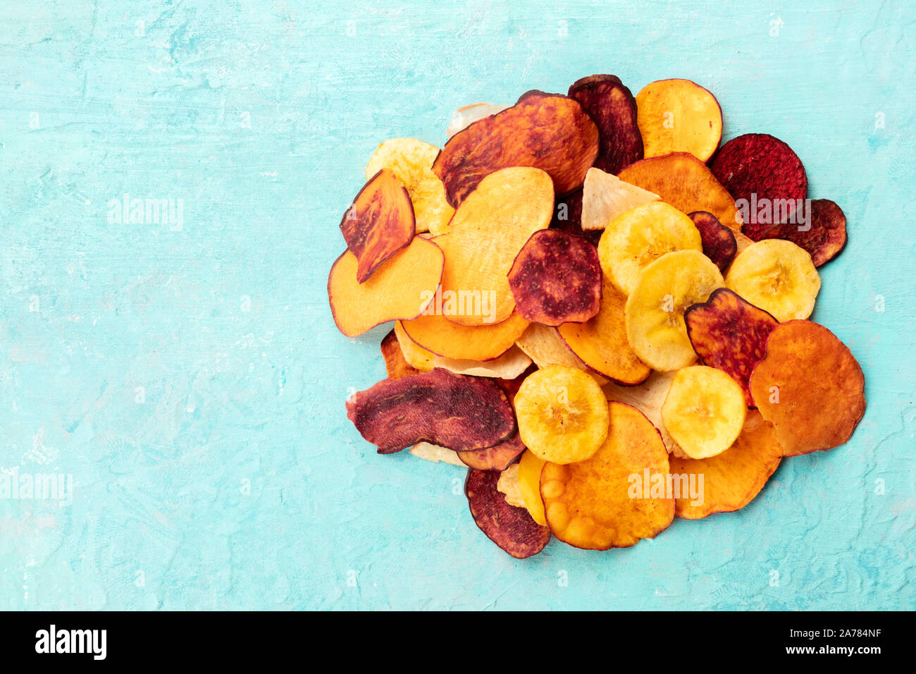 Dried fruit and vegetable chips, healthy vegan snack, a mixed heap on a