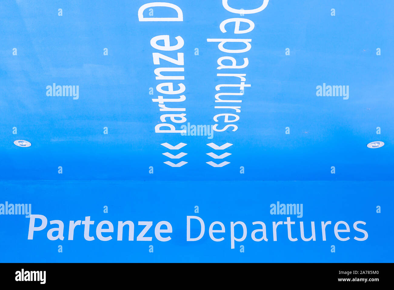 Departure sign of an airport. Entrance of the Trieste Airport with the departure gates, security control, shops and luggage claim. Stock Photo