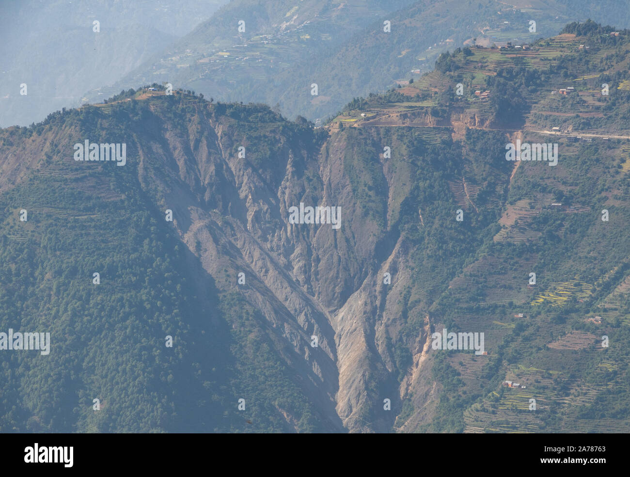 A steep mountain slope scarred by a landslide. Stock Photo