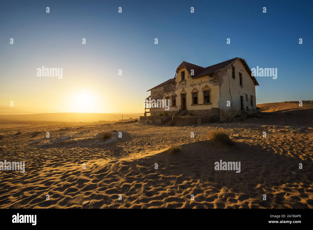 Sunrise above an abandoned house in Kolmanskop ghost town, Namibia Stock Photo