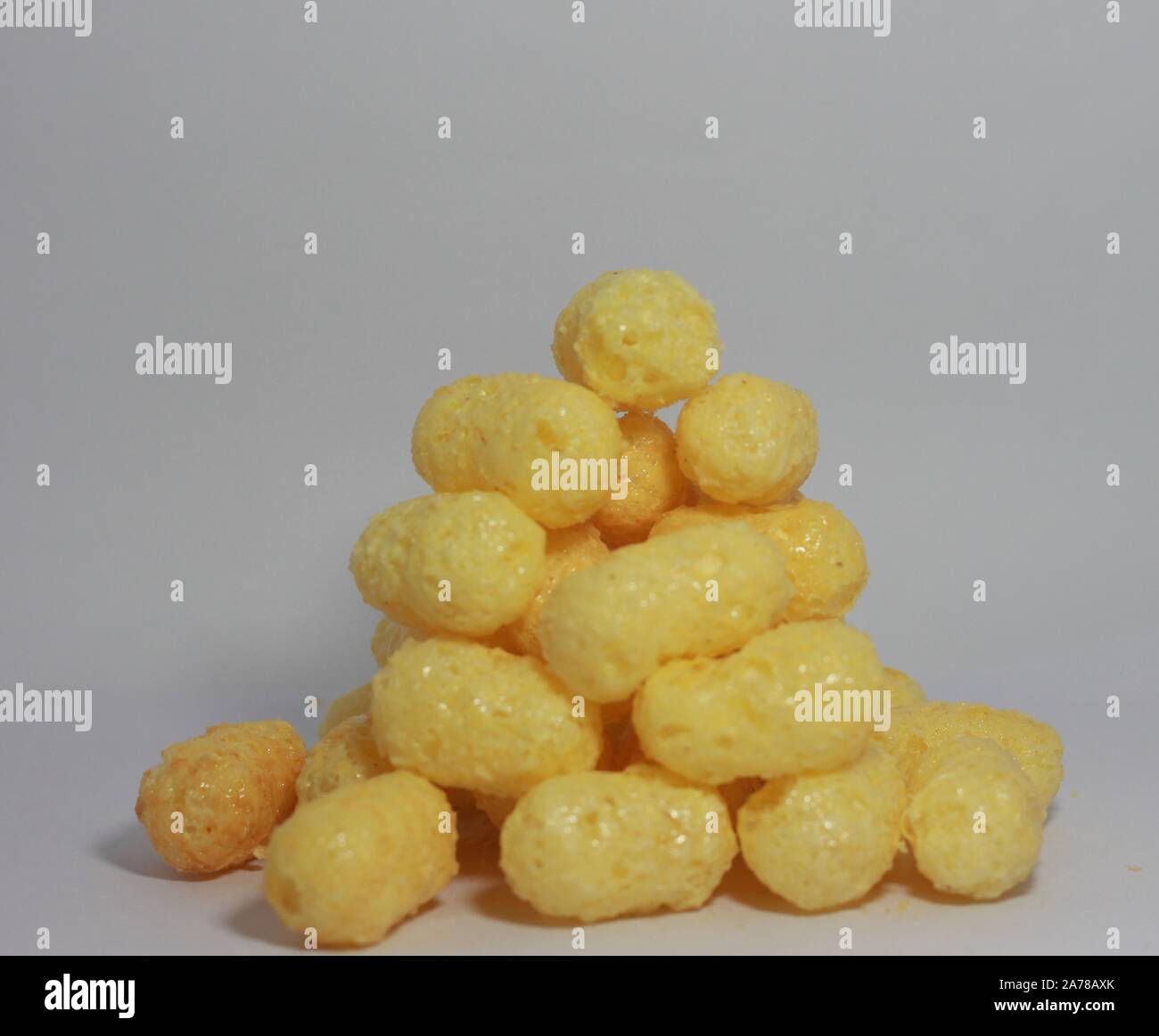 Cheese puff Cheese puffs white background texture food pattern Stock