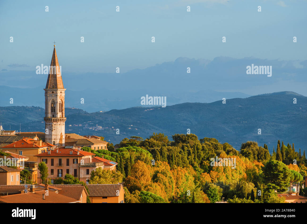 View of the beautiful Perugia medieval historic center and Umbria countryside at sunset with the iconic St Peter hexagonal belltower Stock Photo