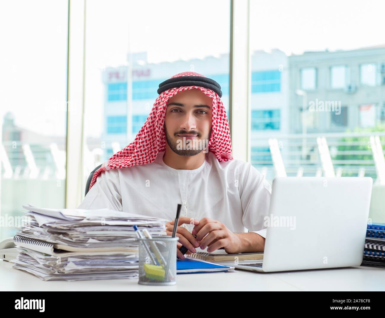 The arab businessman working in the office Stock Photo - Alamy