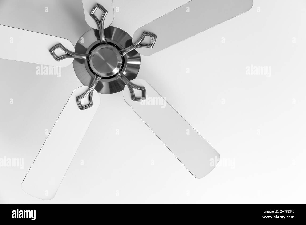 White ceiling fan fragment, close-up photo Stock Photo
