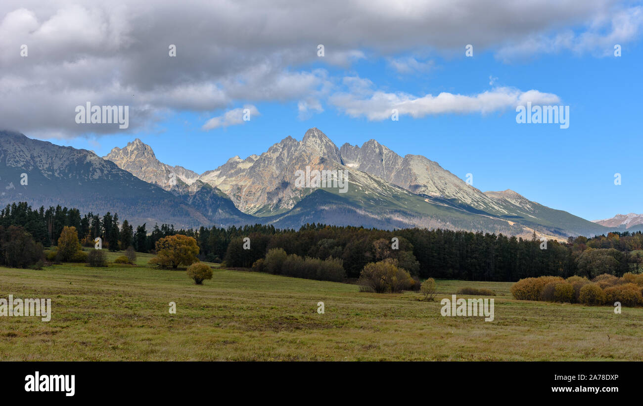 The Lomnicky Peak in the eastern High Tatra Mountains seen from a field Stock Photo