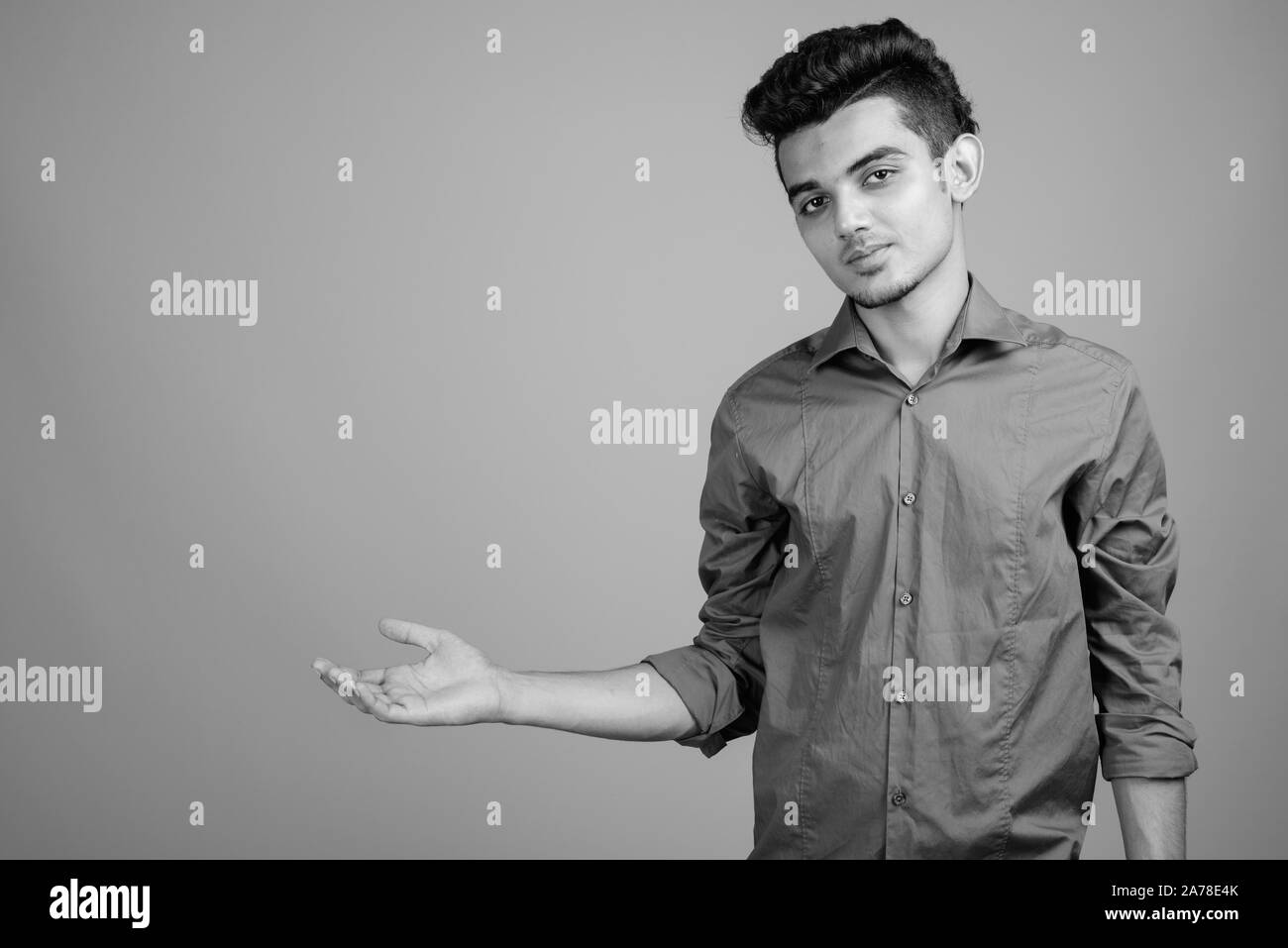 Portrait of young Indian businessman in black and white Stock Photo