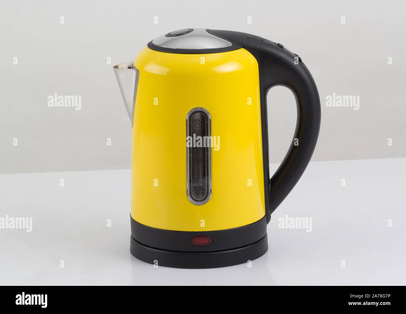 modern yellow electric kettle isolated on white background Stock Photo