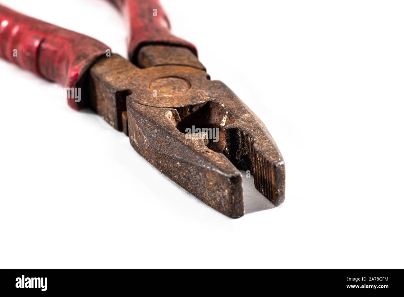 Classic diagonal pliers on a wood table - isolated Stock Photo