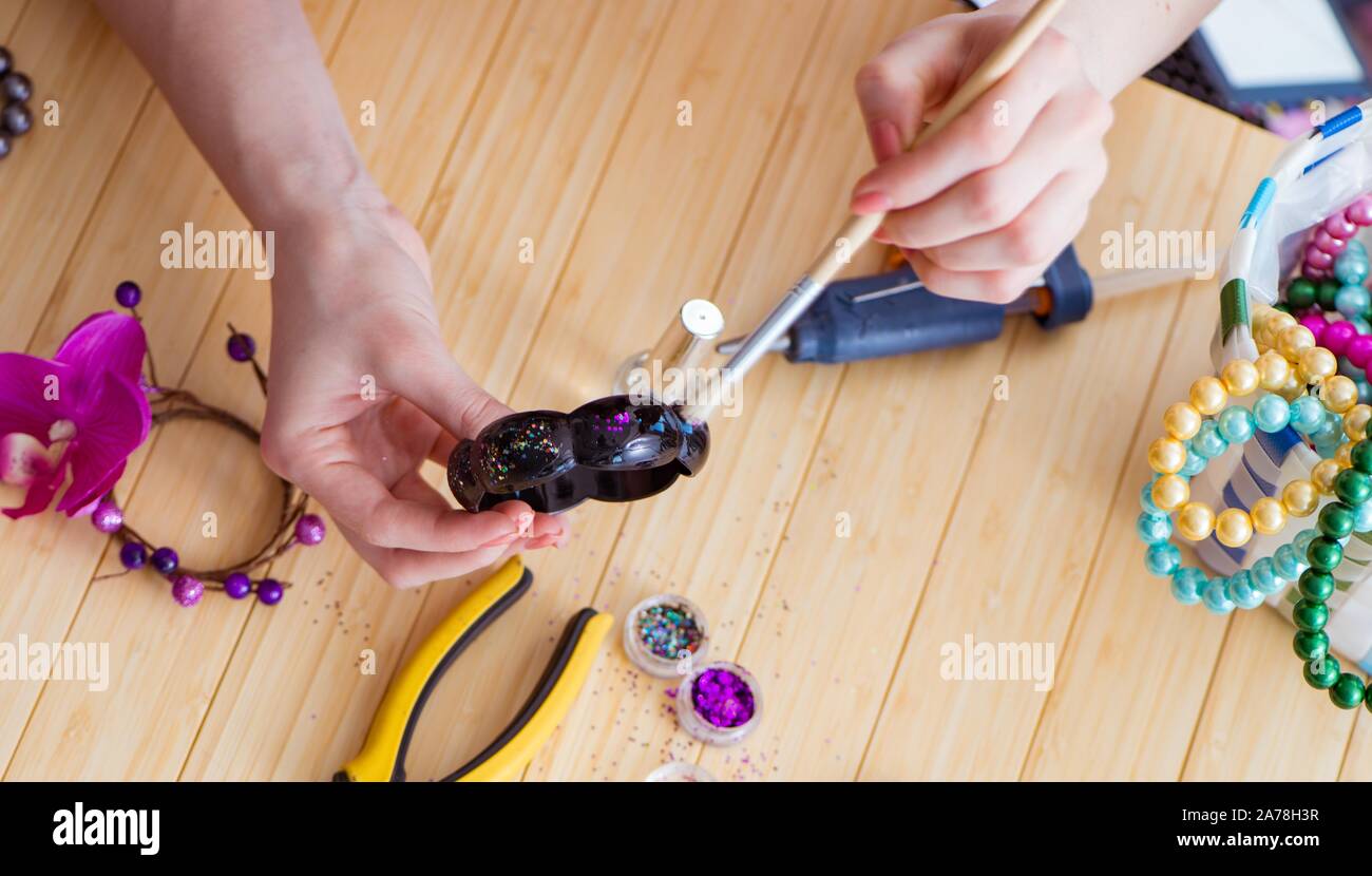 The woman making jewelry at home Stock Photo Alamy
