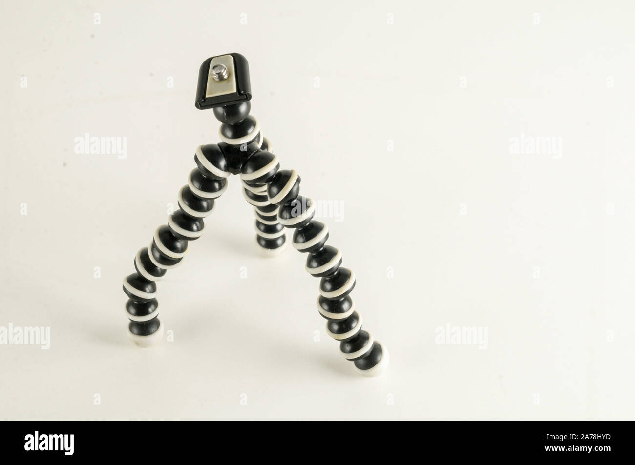 Mini table flexible tripod on white background Stock Photo