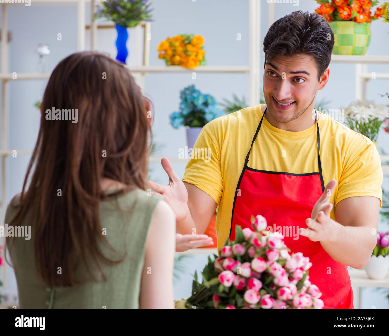 The florist selling flowers in a flower shop Stock Photo Alamy