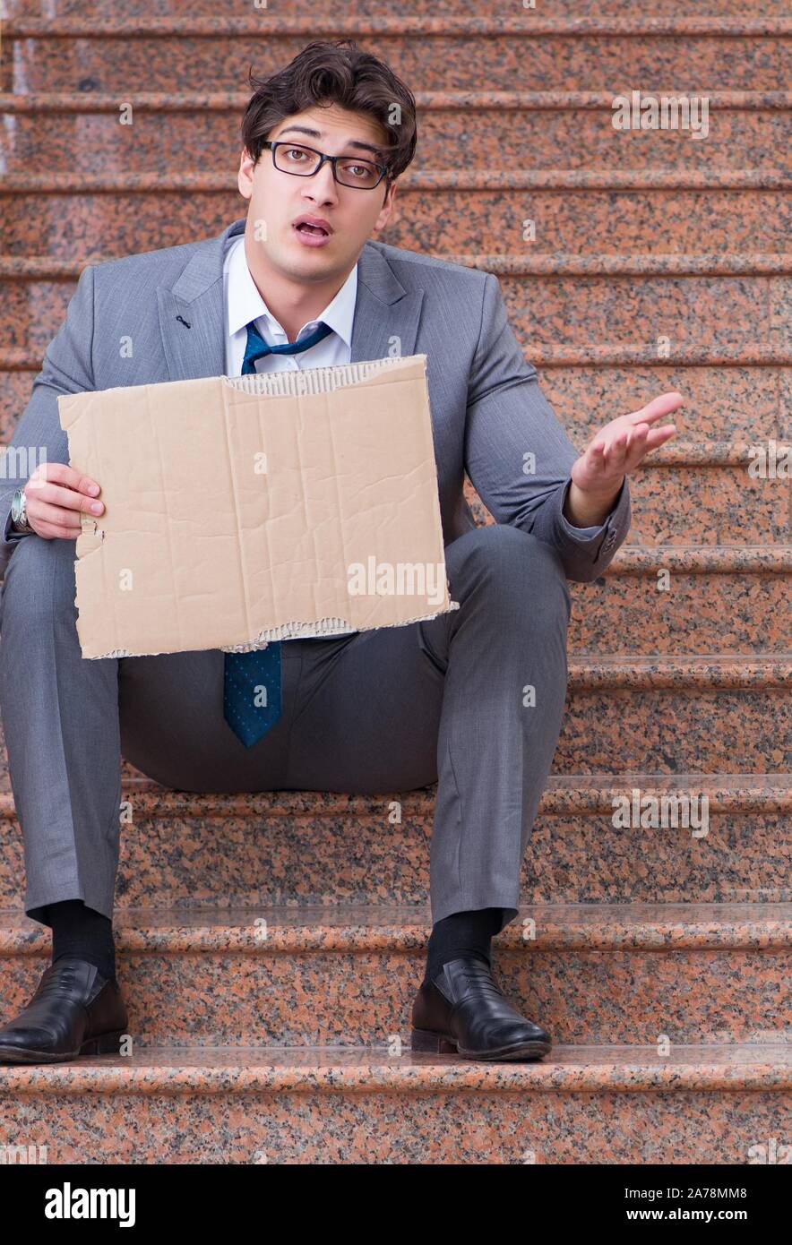 Desperate businessman begging on the street Stock Photo Alamy