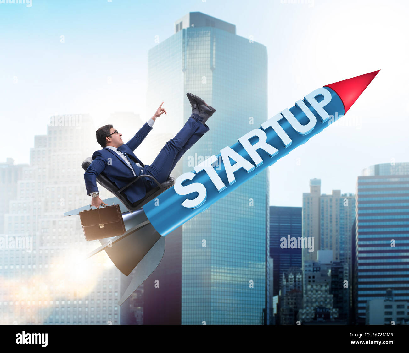 The businessman in start-up concept flying on rocket Stock Photo - Alamy