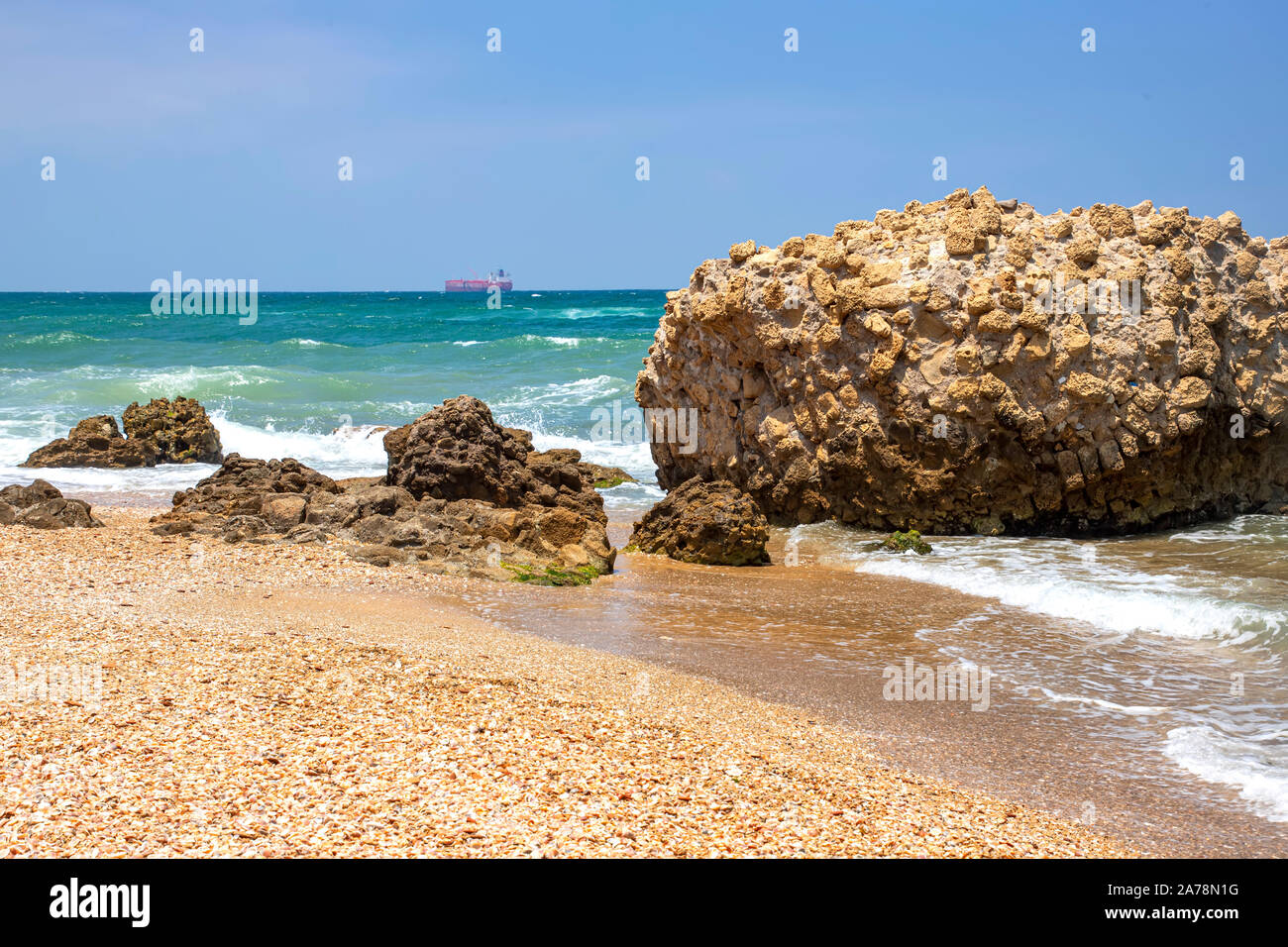 Sea waves crashing on stone formations on the shore of Ashkelon National Park. Israel Stock Photo