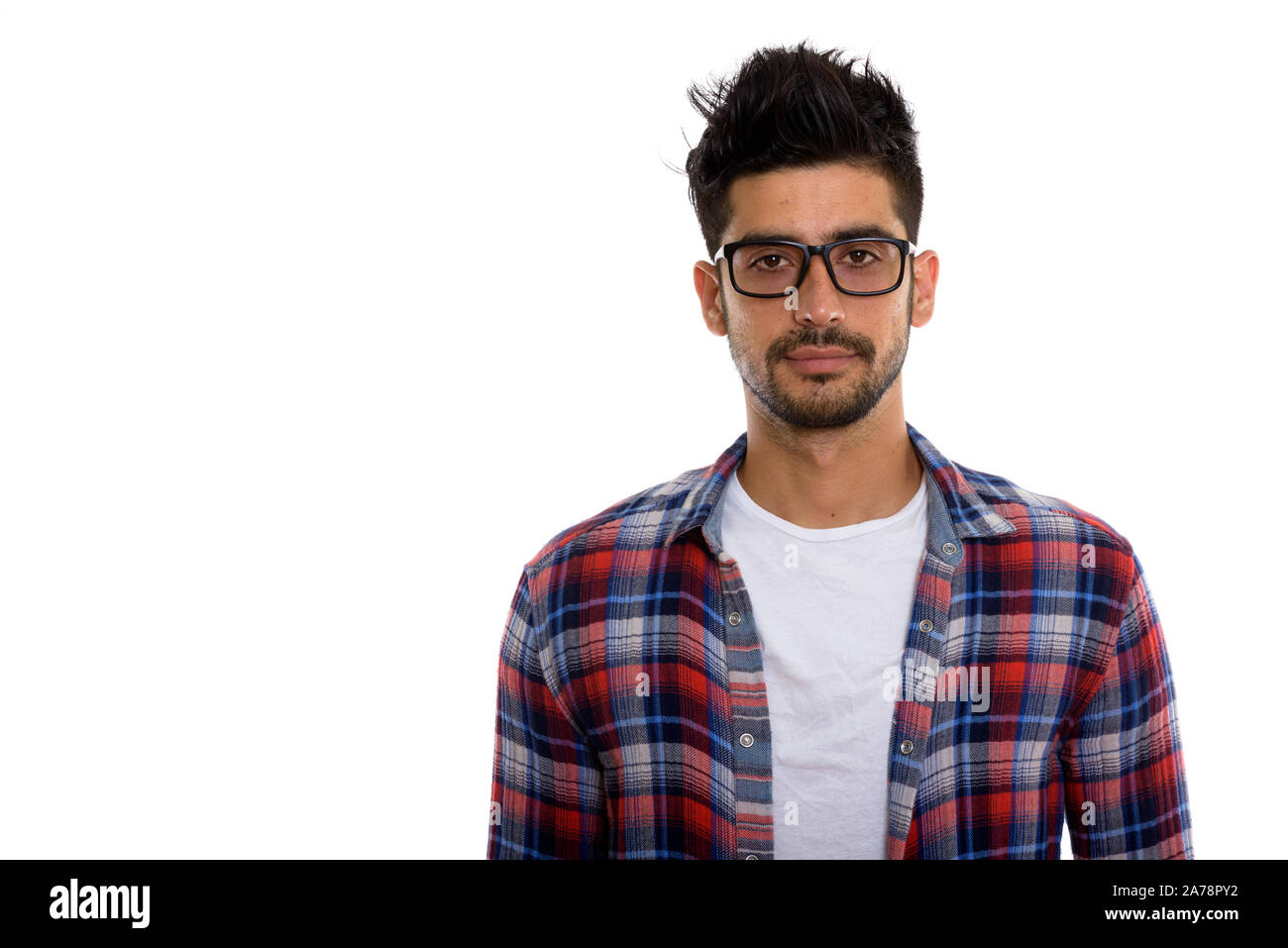 Portrait of young bearded Persian hipster man with eyeglasses Stock Photo