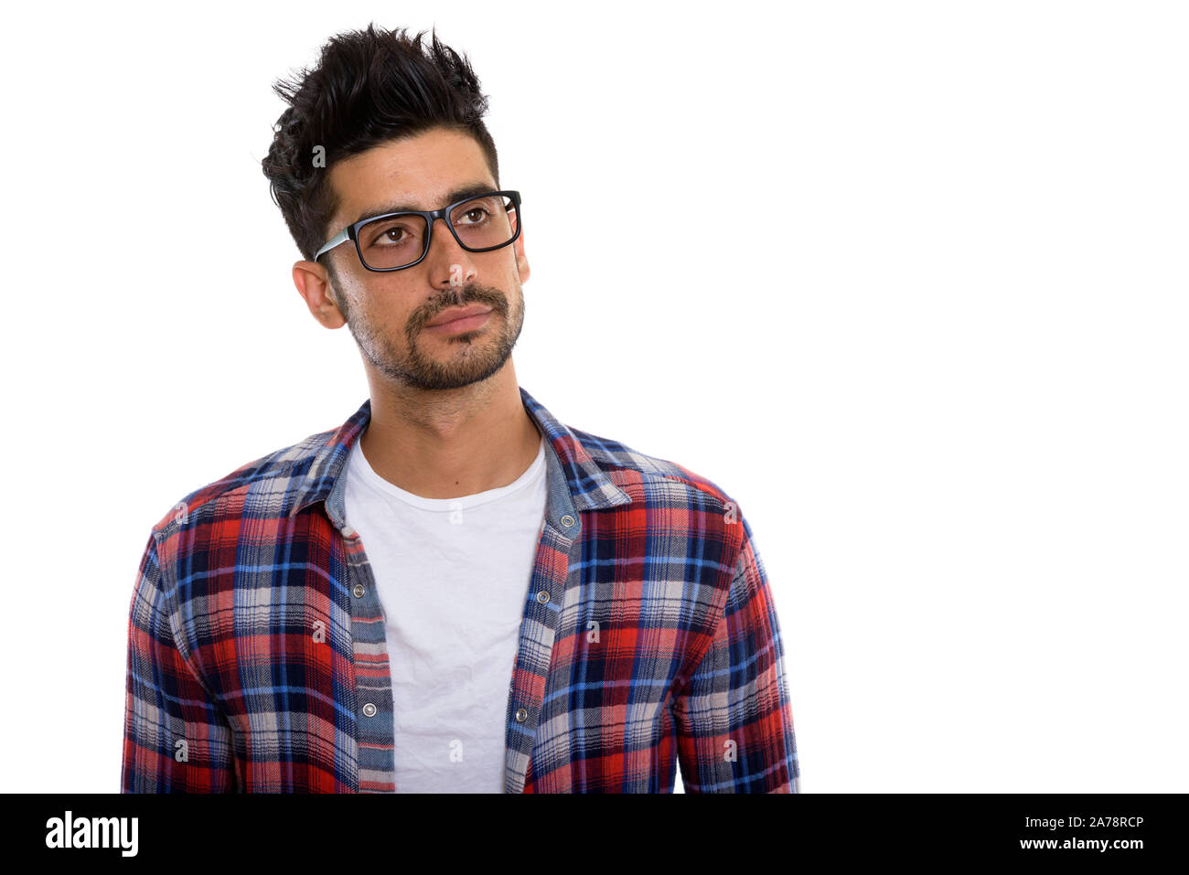 Portrait of young bearded Persian hipster man with eyeglasses Stock Photo