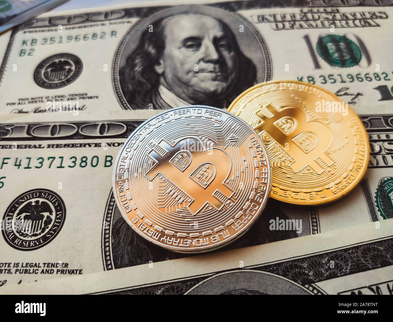 Bitcoin physical coins in US dollars. Digital currency Stock Photo - Alamy