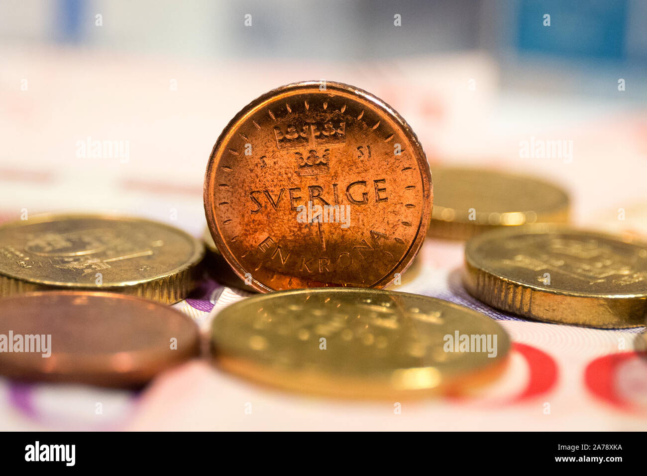 Swedish krona banknotes and coins.The krona is the official currency of  Sweden. Both the ISO code "SEK" and currency sign "kr" are in common use  Stock Photo - Alamy