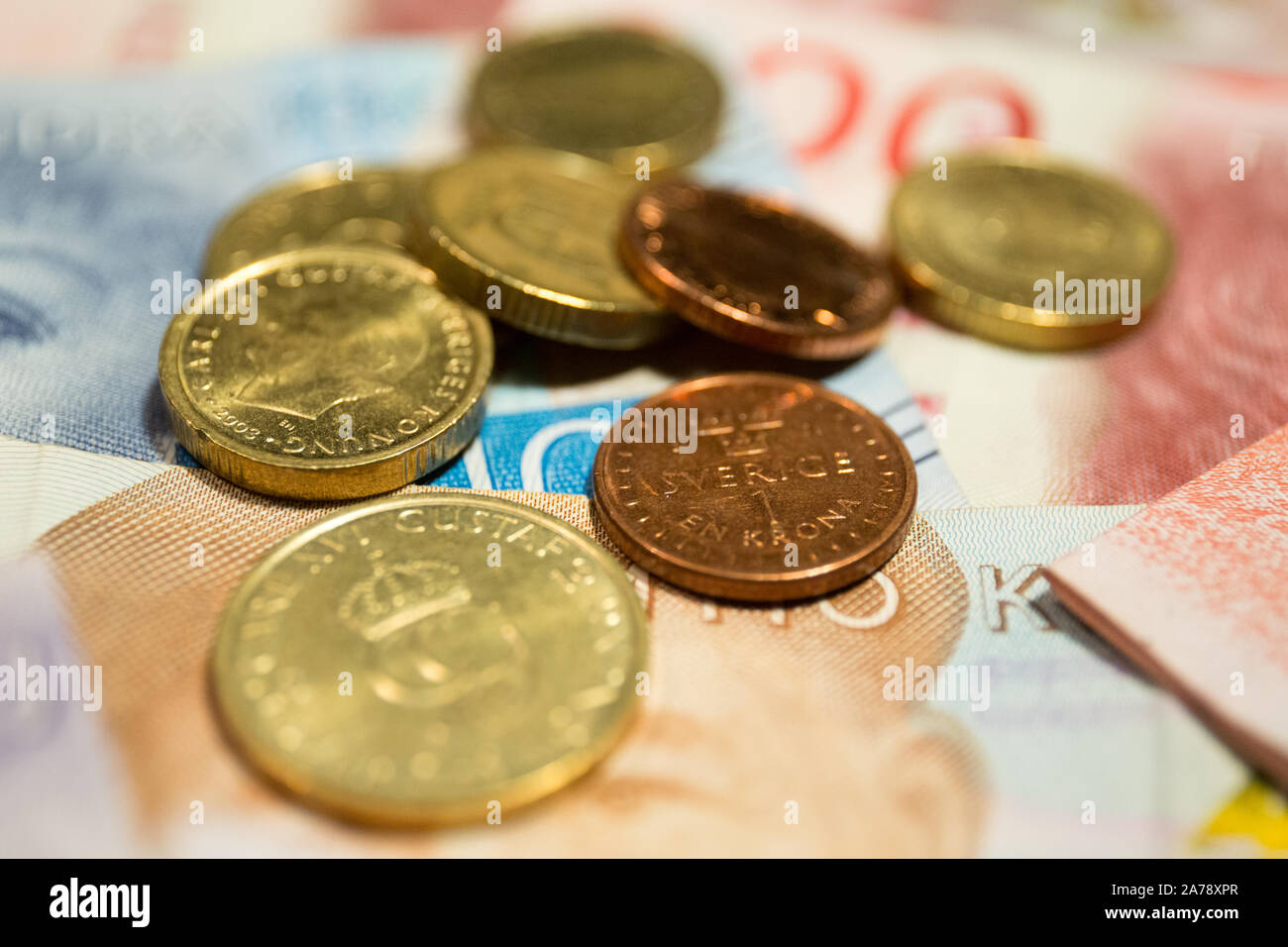 Swedish krona banknotes and coins.The krona is the official currency of Sweden. Both the ISO