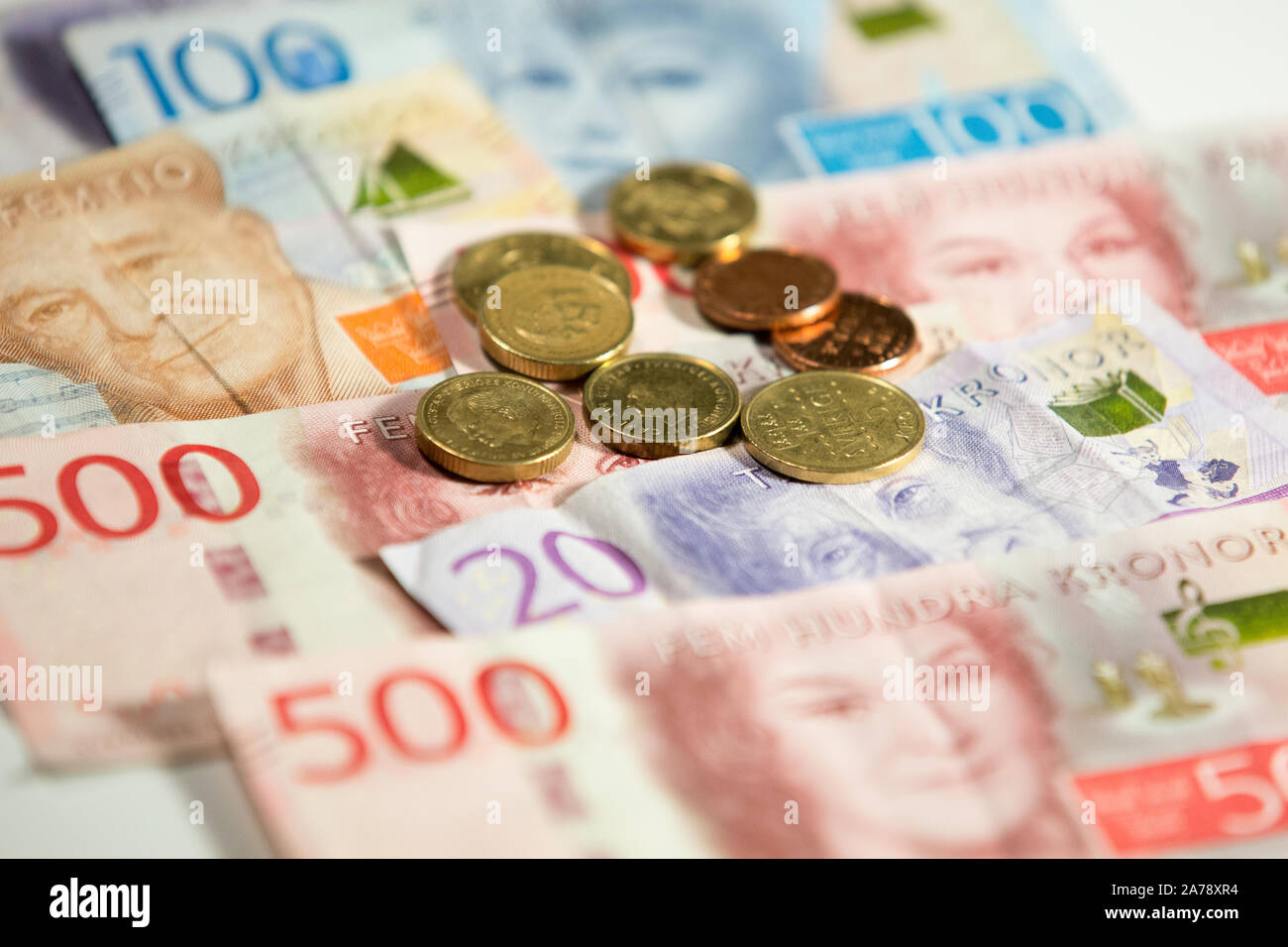 Swedish krona banknotes and coins.The krona is the official currency of