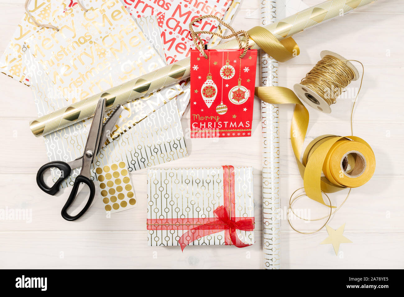https://c8.alamy.com/comp/2A78YE5/flat-lay-of-christmas-gifts-decoration-paper-ribbons-and-scissors-christmas-gift-concept-top-view-2A78YE5.jpg