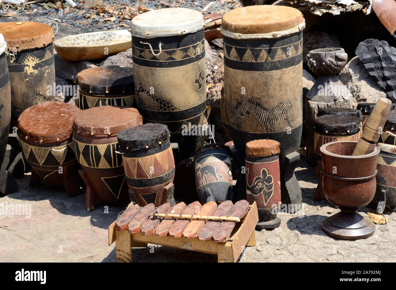 Painted African tribal drums for sale at a street market Botswana Africa Stock Photo