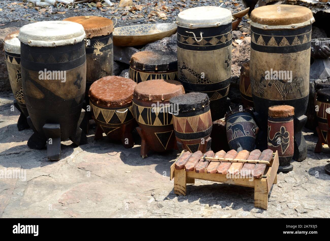 Painted African tribal drums for sale at a street market Botswana Africa Stock Photo