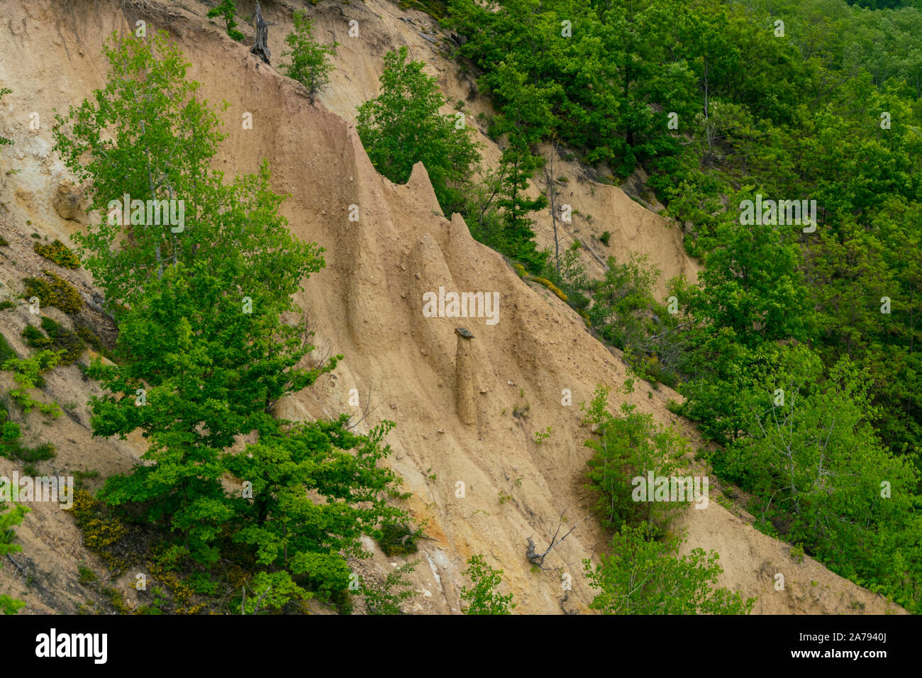 Panorama of sandstone pyramids with stones on top - rock formations in Djavolja Varos or Devil town, Serbia Stock Photo