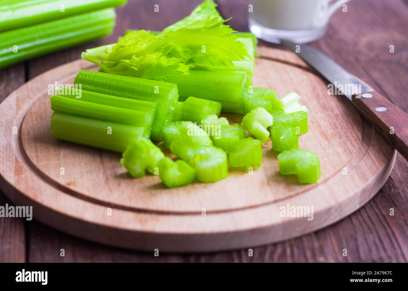 fresh juicy celery, celery stalks close up on wooden background Stock Photo
