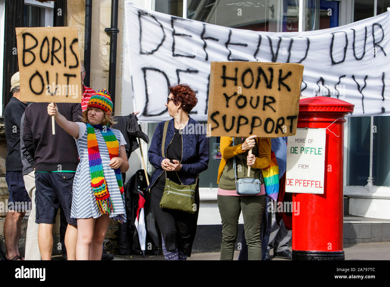 31-08-2019. Protesters carrying signs and placards are pictured as they protest outside the Chippenham offices of conservative MP Michelle Donelan Stock Photo