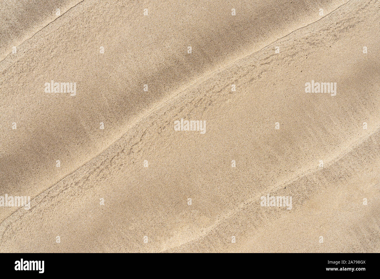top view of wave pattern on sand beach background Stock Photo