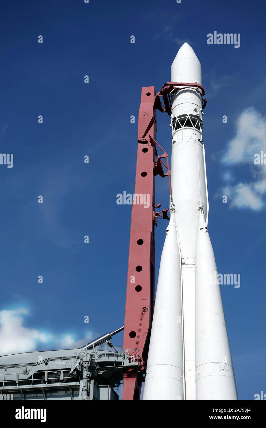 Spaceship on launch pad ready to fly into space vertical photo over blue sky vertical photo Stock Photo