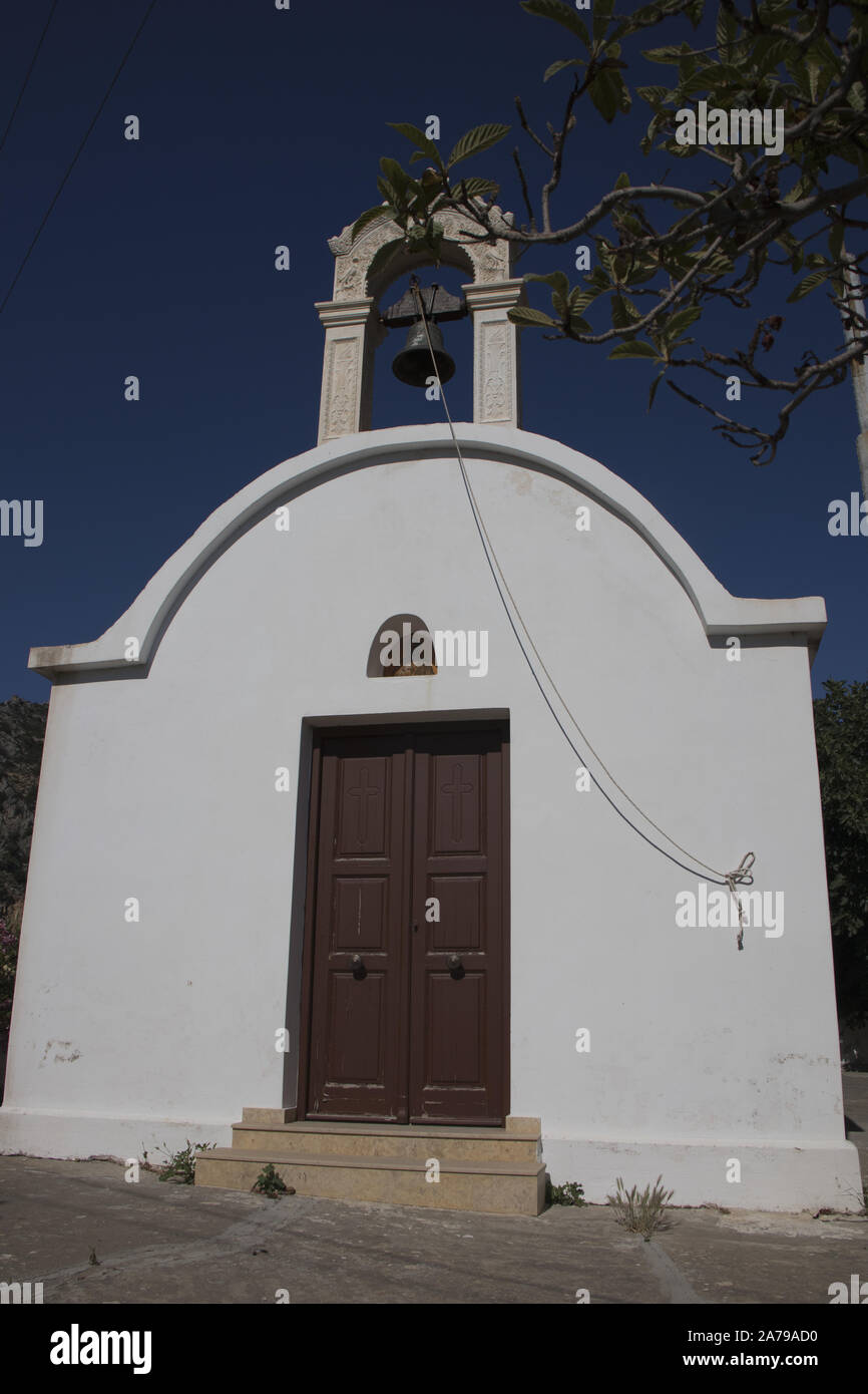 Small church hidden in a village near Paleochora, Crete, Greece Stock Photo