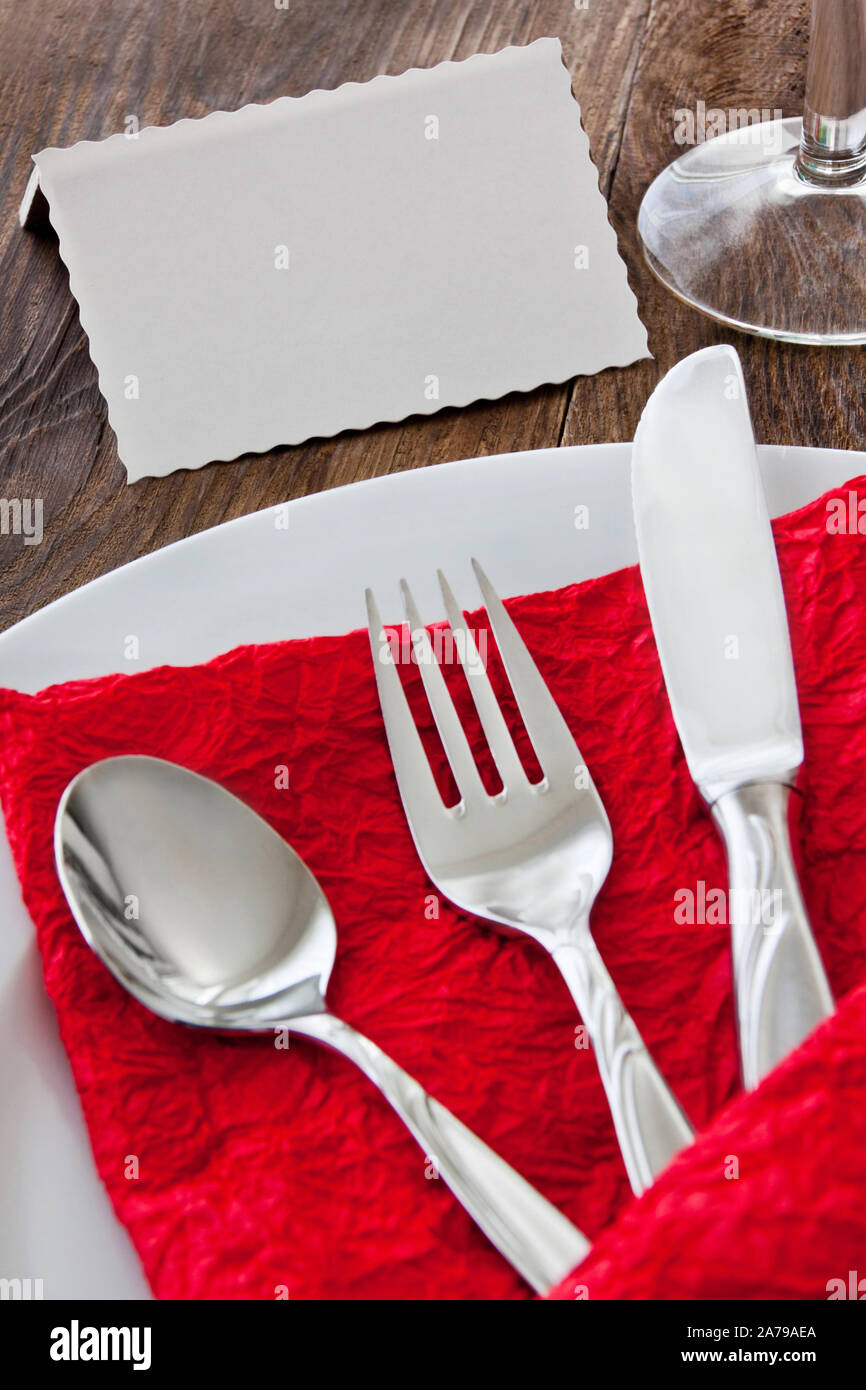 Eating table dishes and flatware with label Stock Photo Alamy