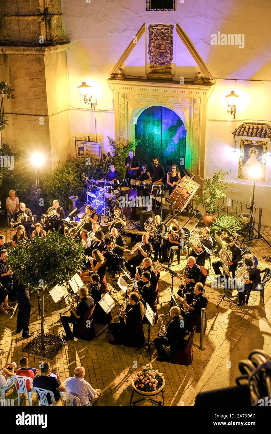 Summer evening outdoor public concert of popular music by the town band in front of Plaza San Marcos in Carcabuey, Cordoba Province, Andalucia, Spain Stock Photo