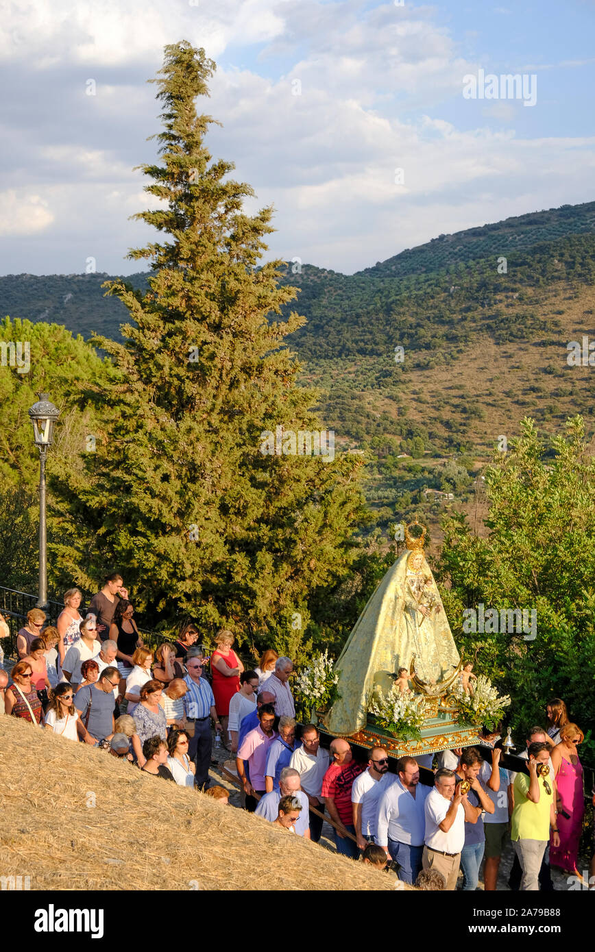 Fiesta of Virgen del Castillo, the bearers carrying the patron saint of Carcabuey down to the church. Andalucia, Spain Stock Photo