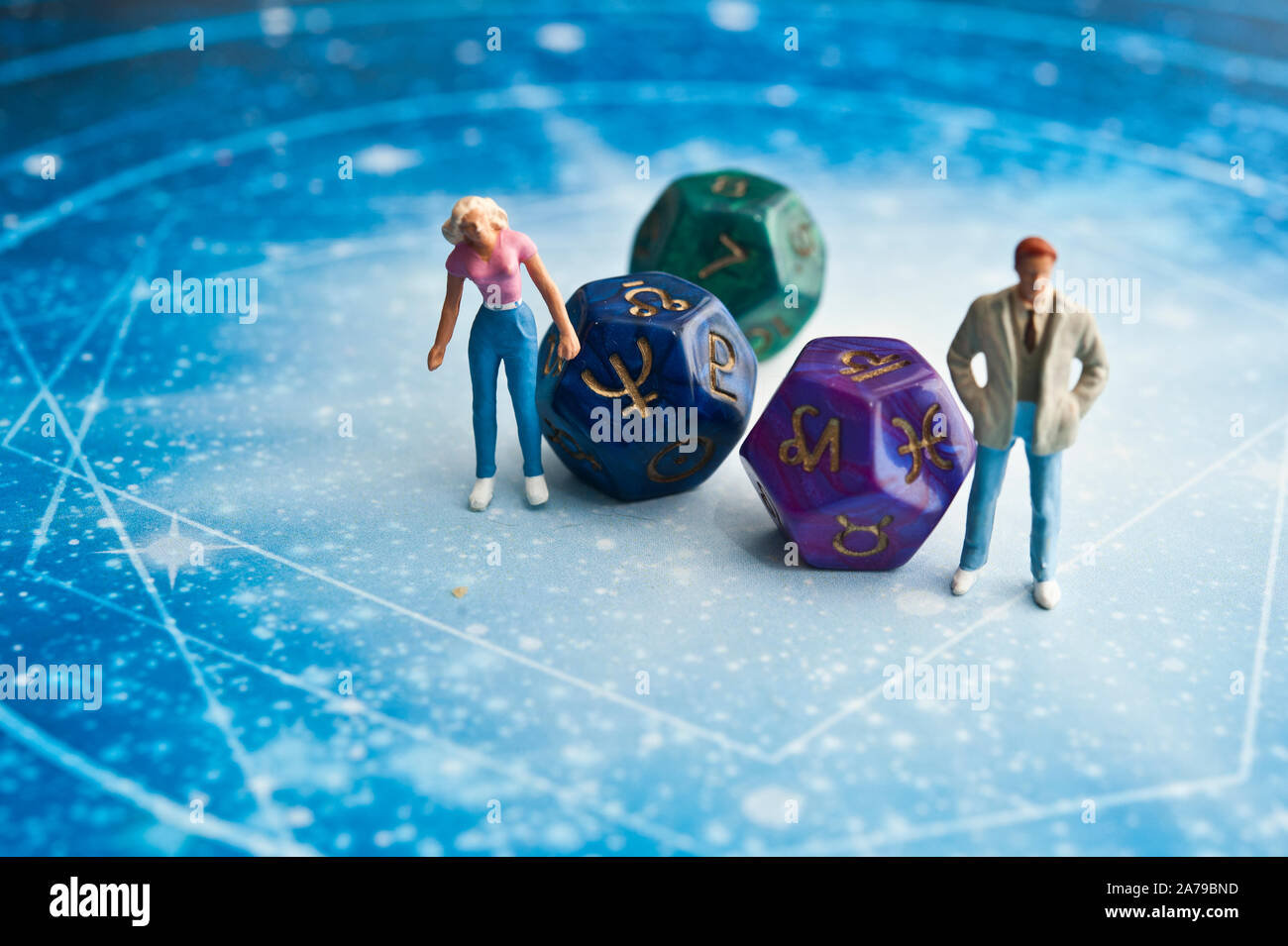 miniature figurines and esoteric dice, fortune telling concept Stock